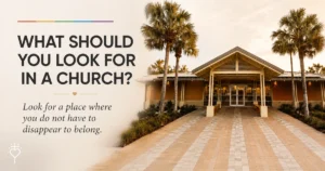 Front entrance of a modern church framed by palm trees beneath the words, "What should you look for in a church?" and "Look for a place where you do not have to disappear to belong."